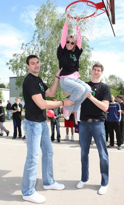 dalibor bagaric basketball players hold up short girl