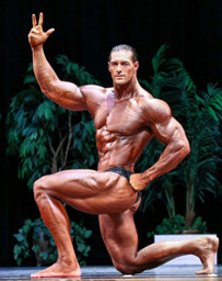 bodybuilder aaron reed competition kneeling