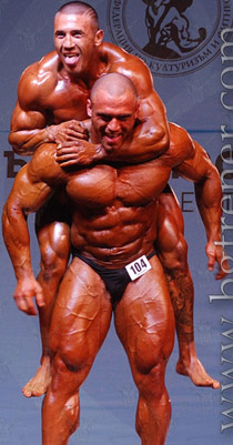 bodybuilders clowning on stage piggyback